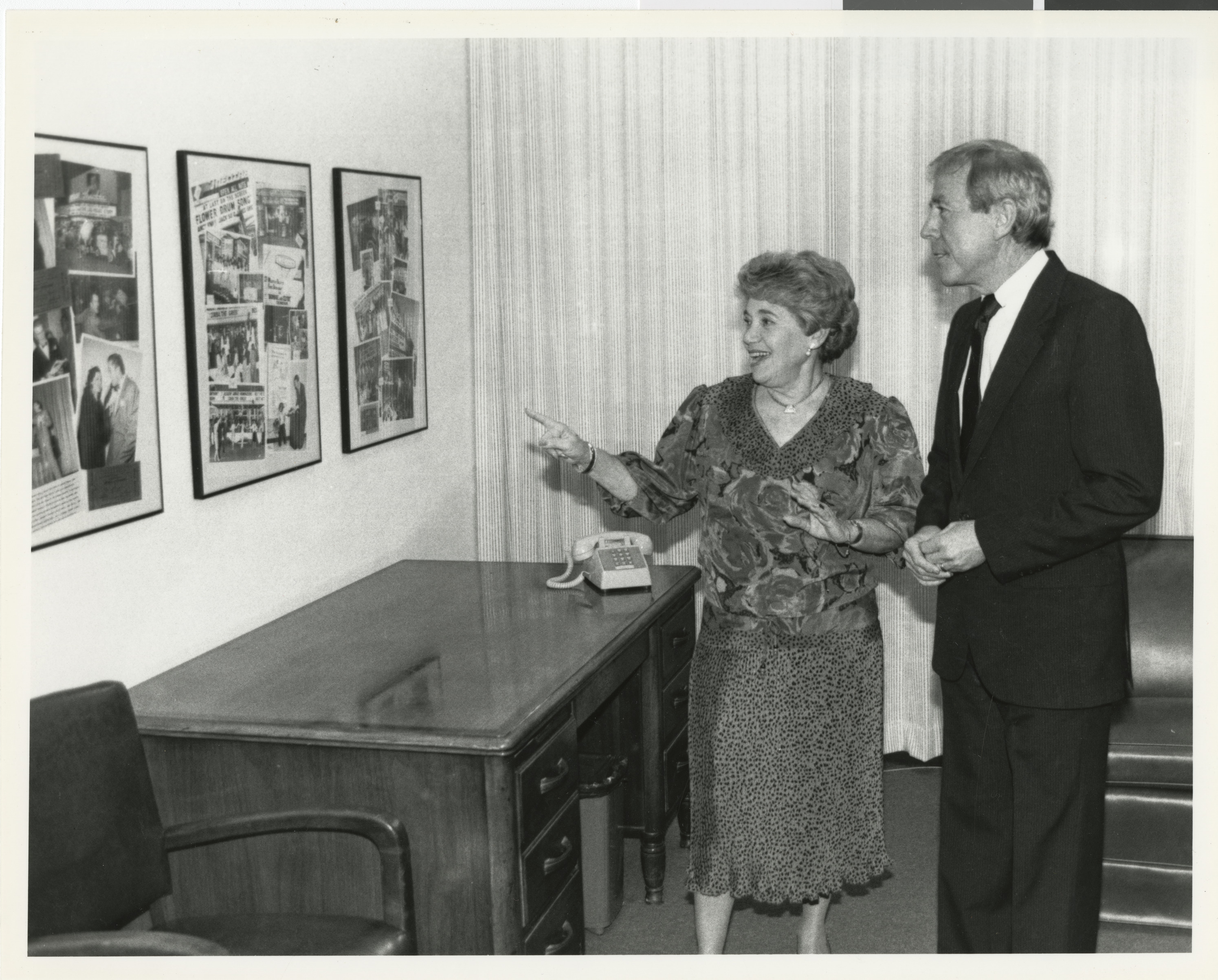 Photograph of Edythe Katz presenting collages at the Lloyd Katz Honors Lounge at UNLV Library