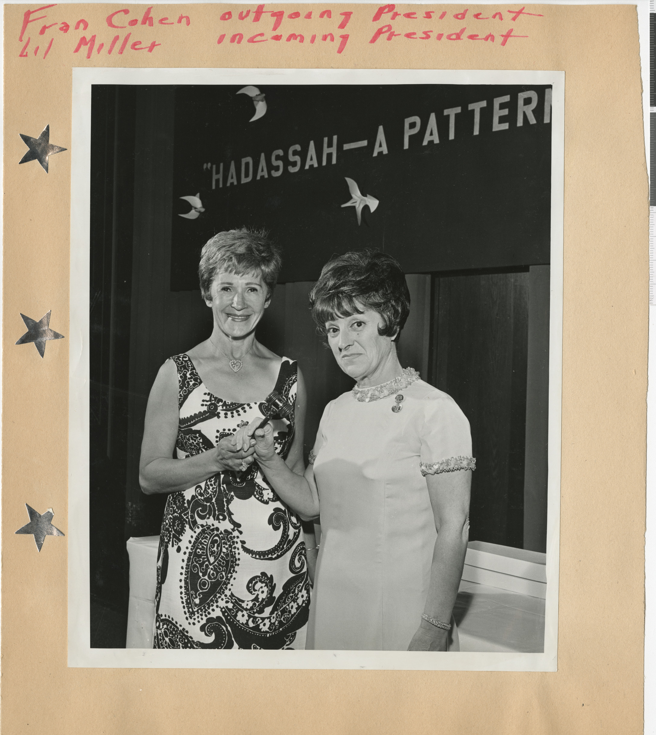 Photograph of Fran Cohen (outgoing president) and Lillian Miller (incoming president), June 1967