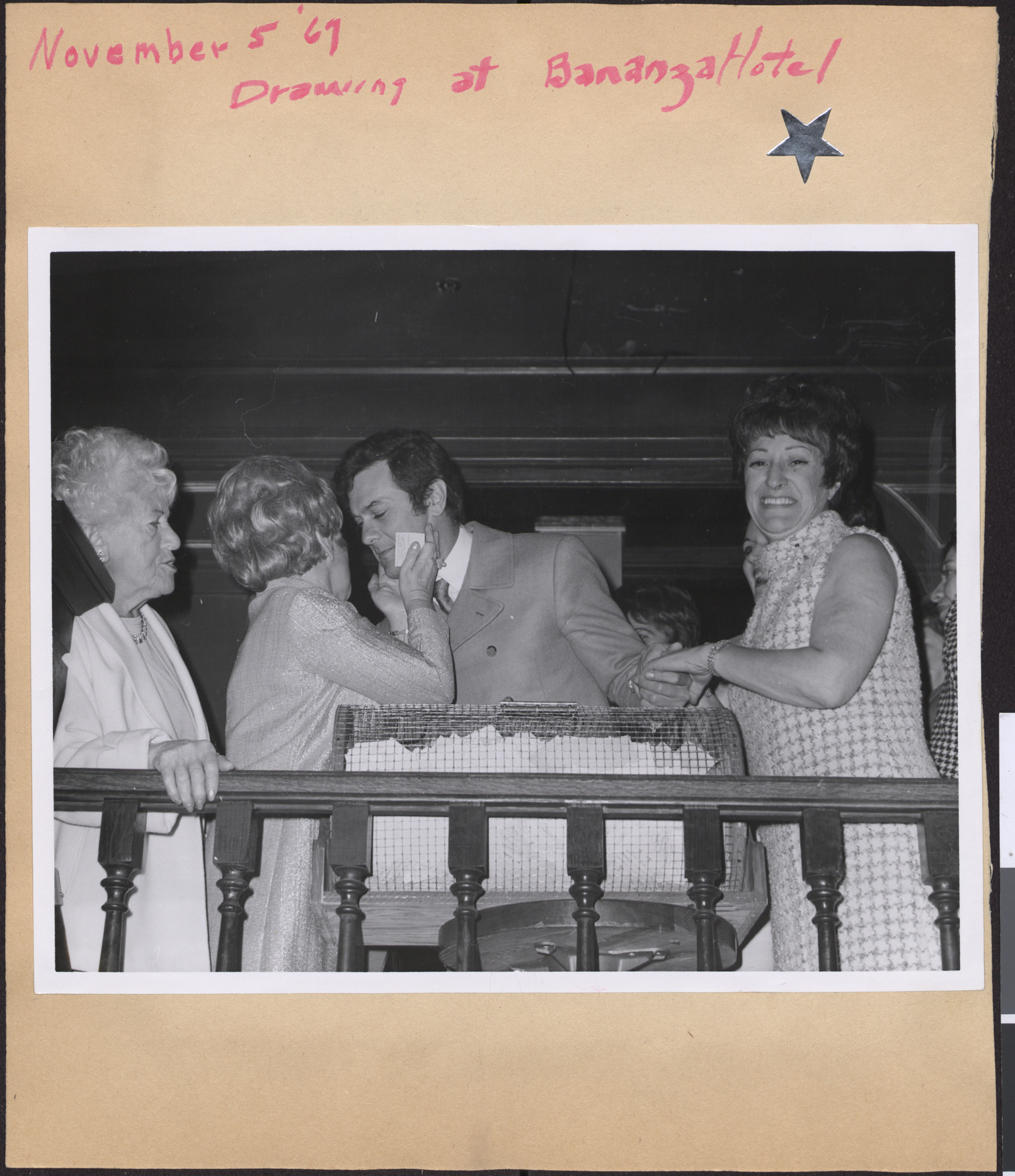 Cocktail Party, Bonanza Hotel: Photograph of Tony Curtis with Hadassah members drawing winning ticket, November 5, 1967
