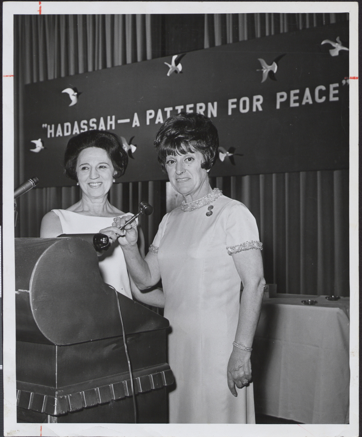 Photograph of Lillian Miller accepting president's gavel