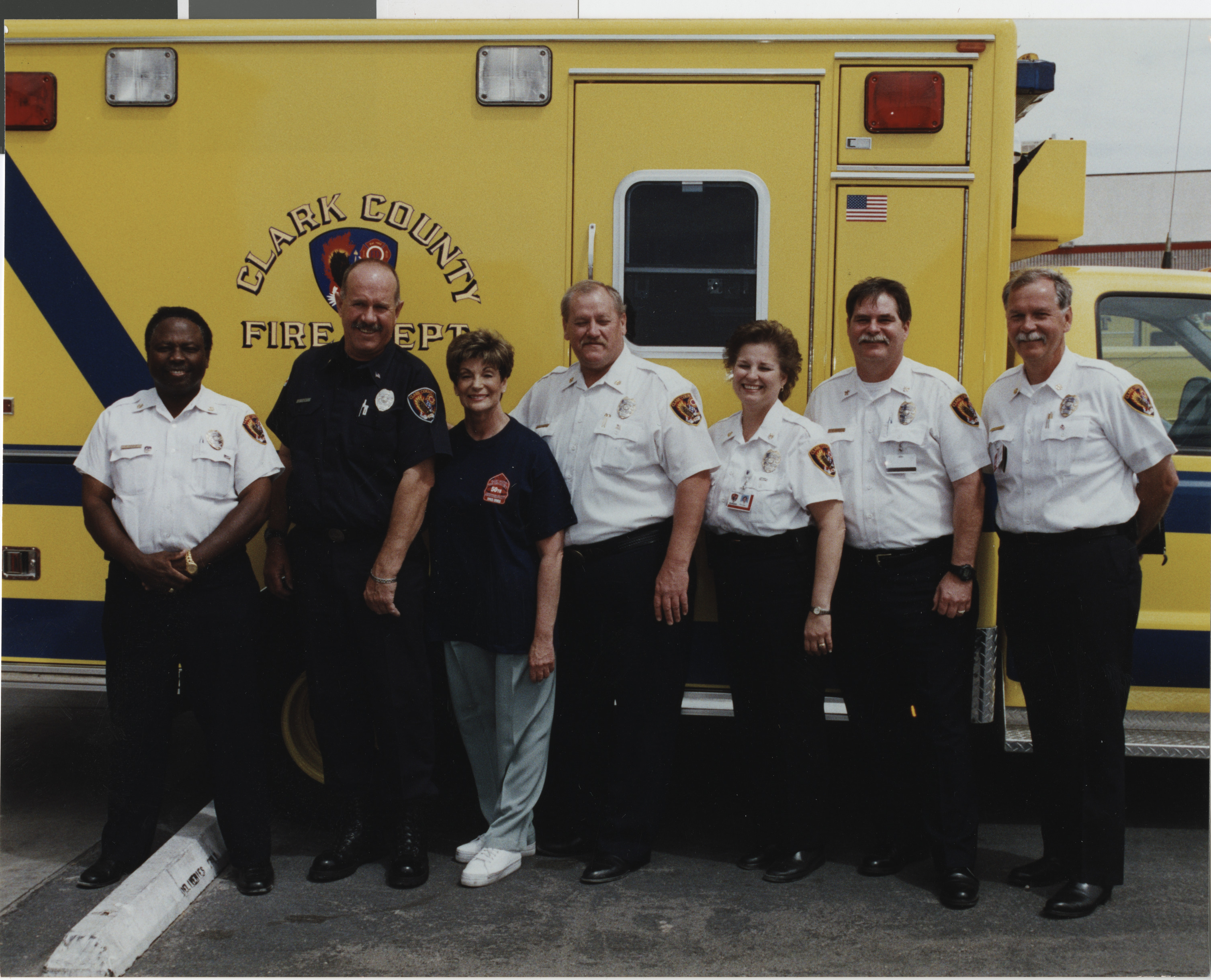 Photograph of Shelley Berkley posing with Clark County Fire Department, May 16, 2003