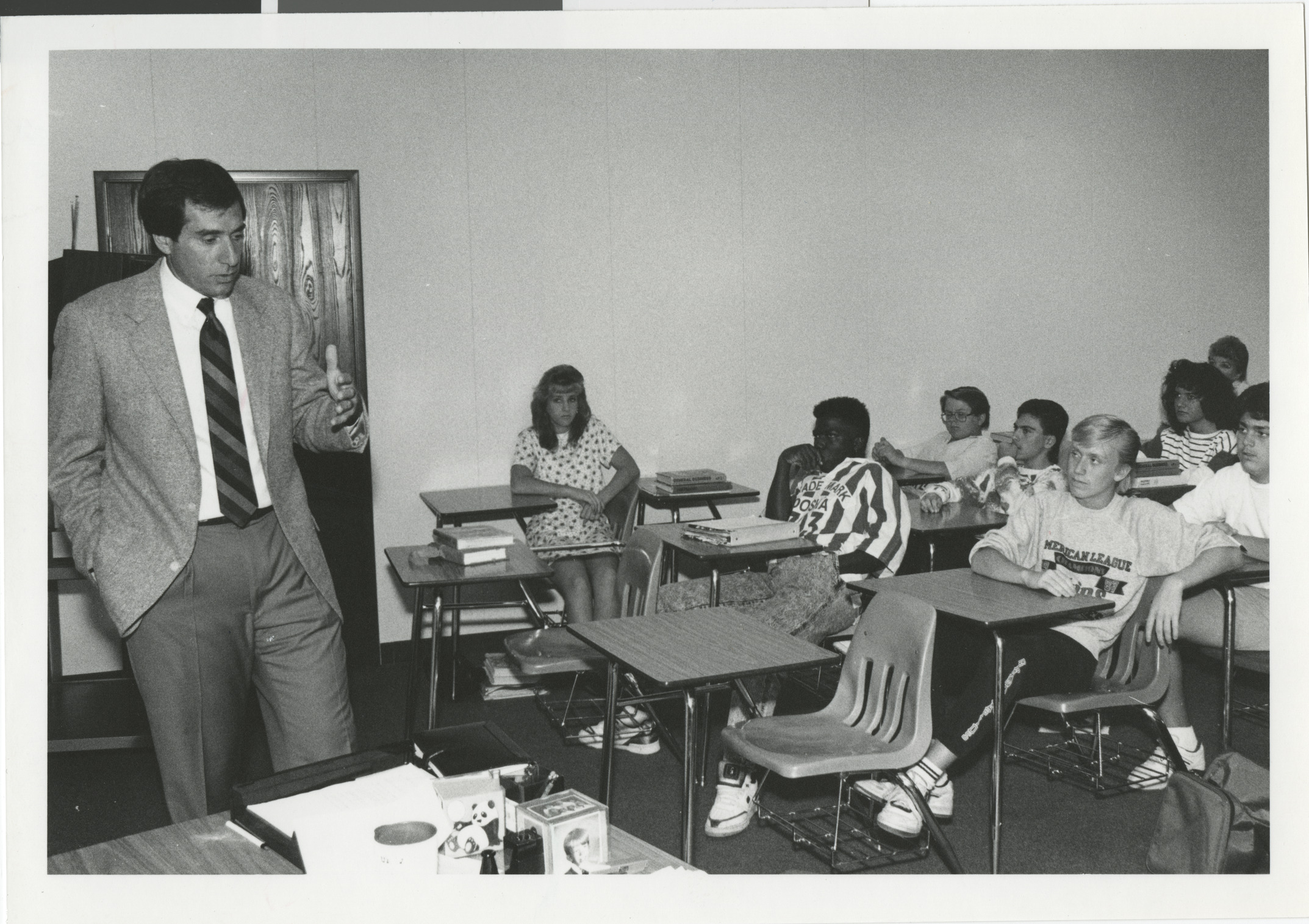 Photograph of Mark Fine speaking to students in a classroom, undated