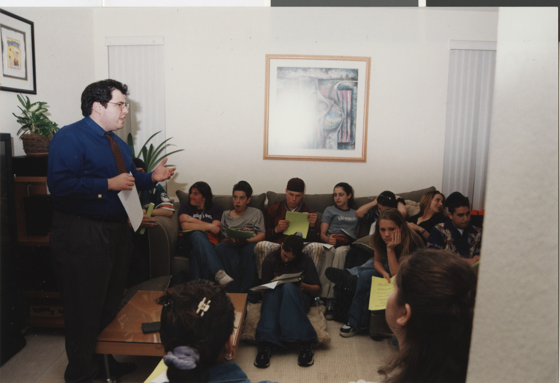 Photograph of Rabbi Goodman speaking to young adults, 1990s
