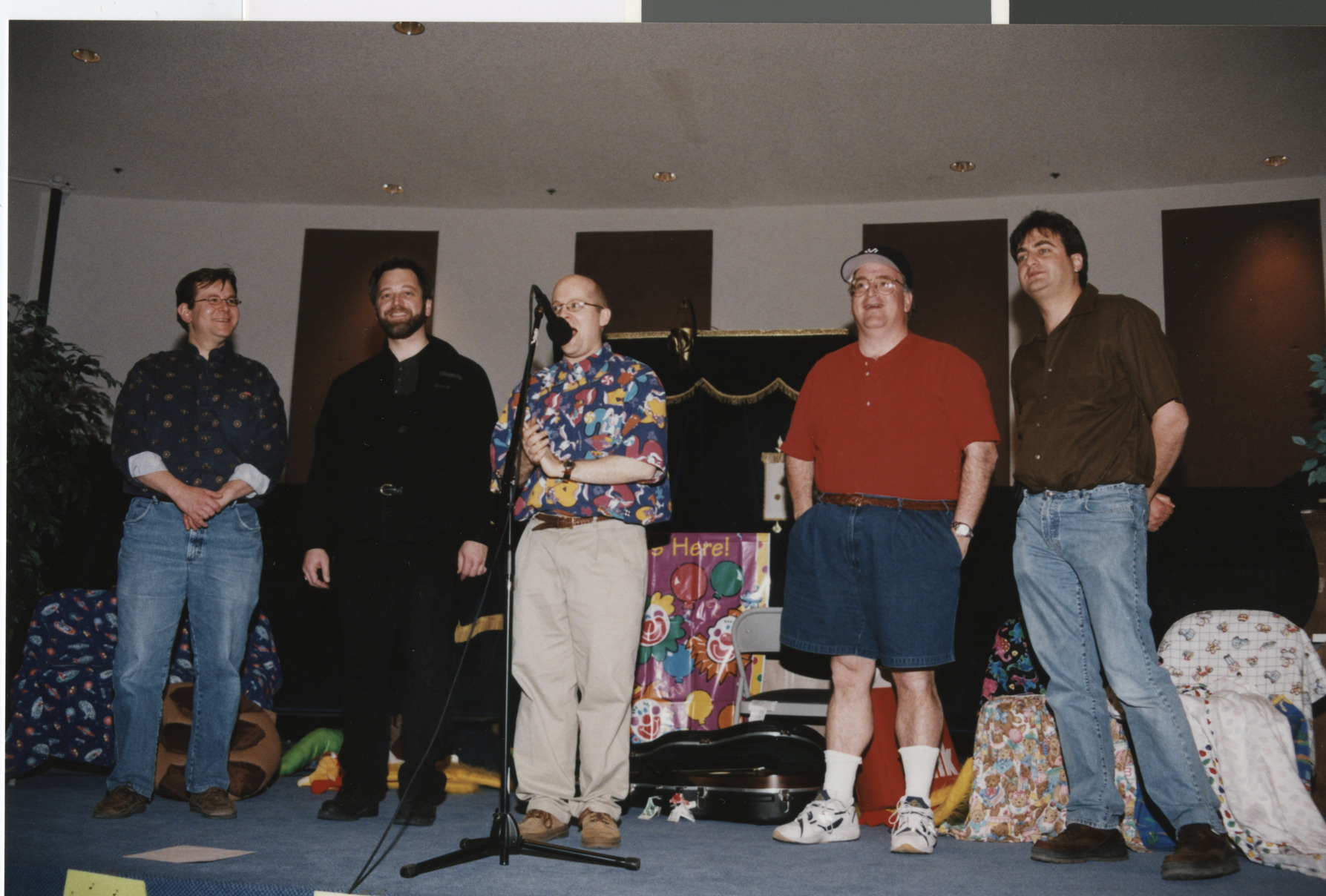 Photograph of men on a stage, 1990s