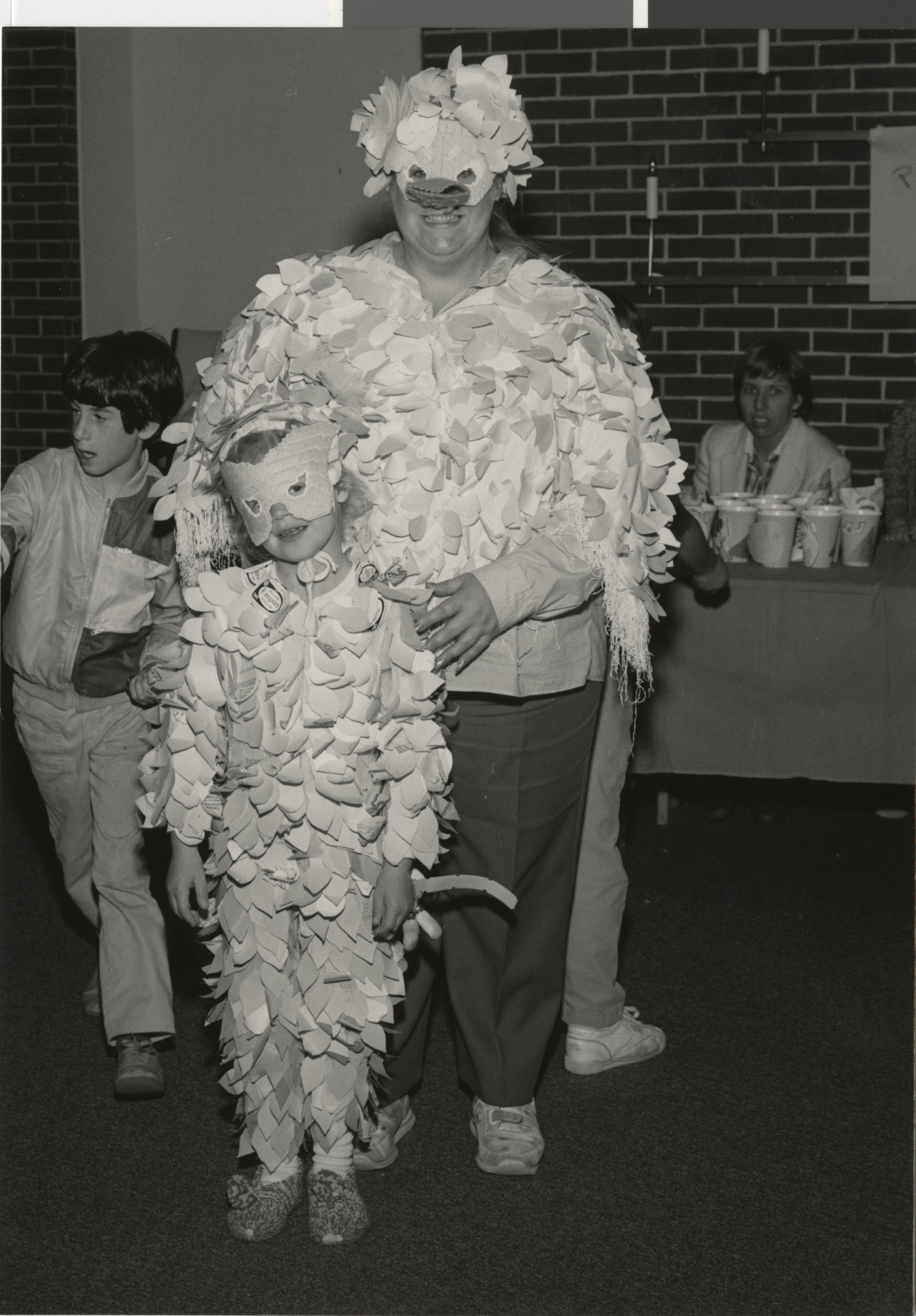 Photograph of Andee Boiman and Jackie Boiman dressed as birds, 1980s