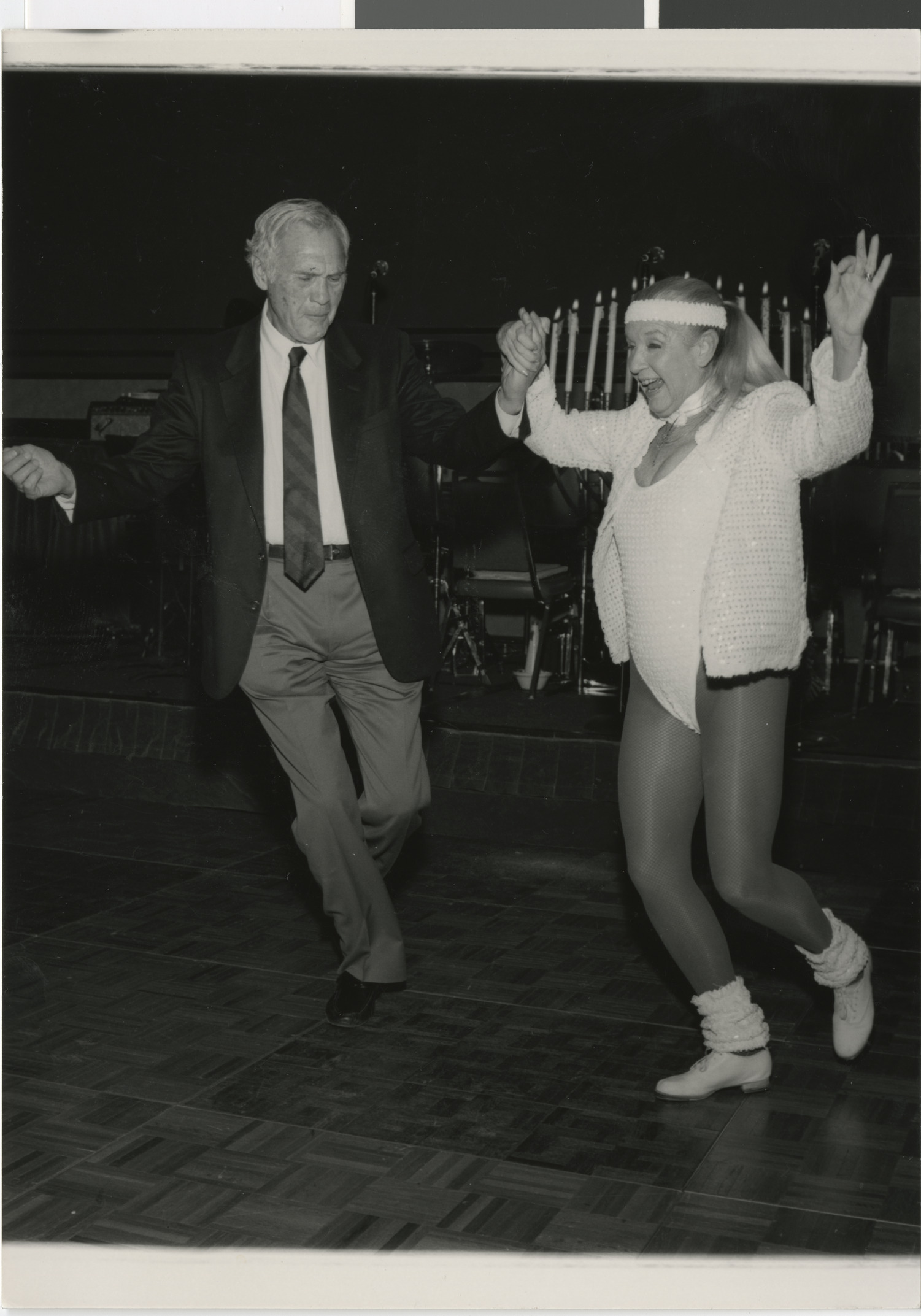 Photograph of Hank Greenspun dancing with Peggy Ryan, 1980s