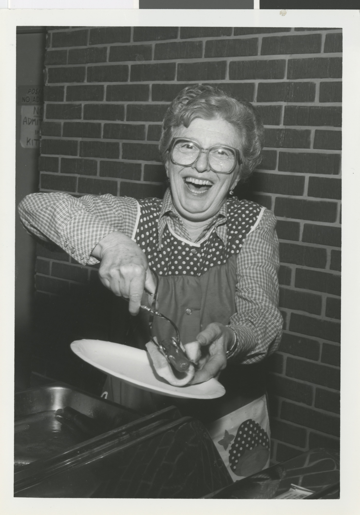 Photograph of a lady with a hotdog, 1980s