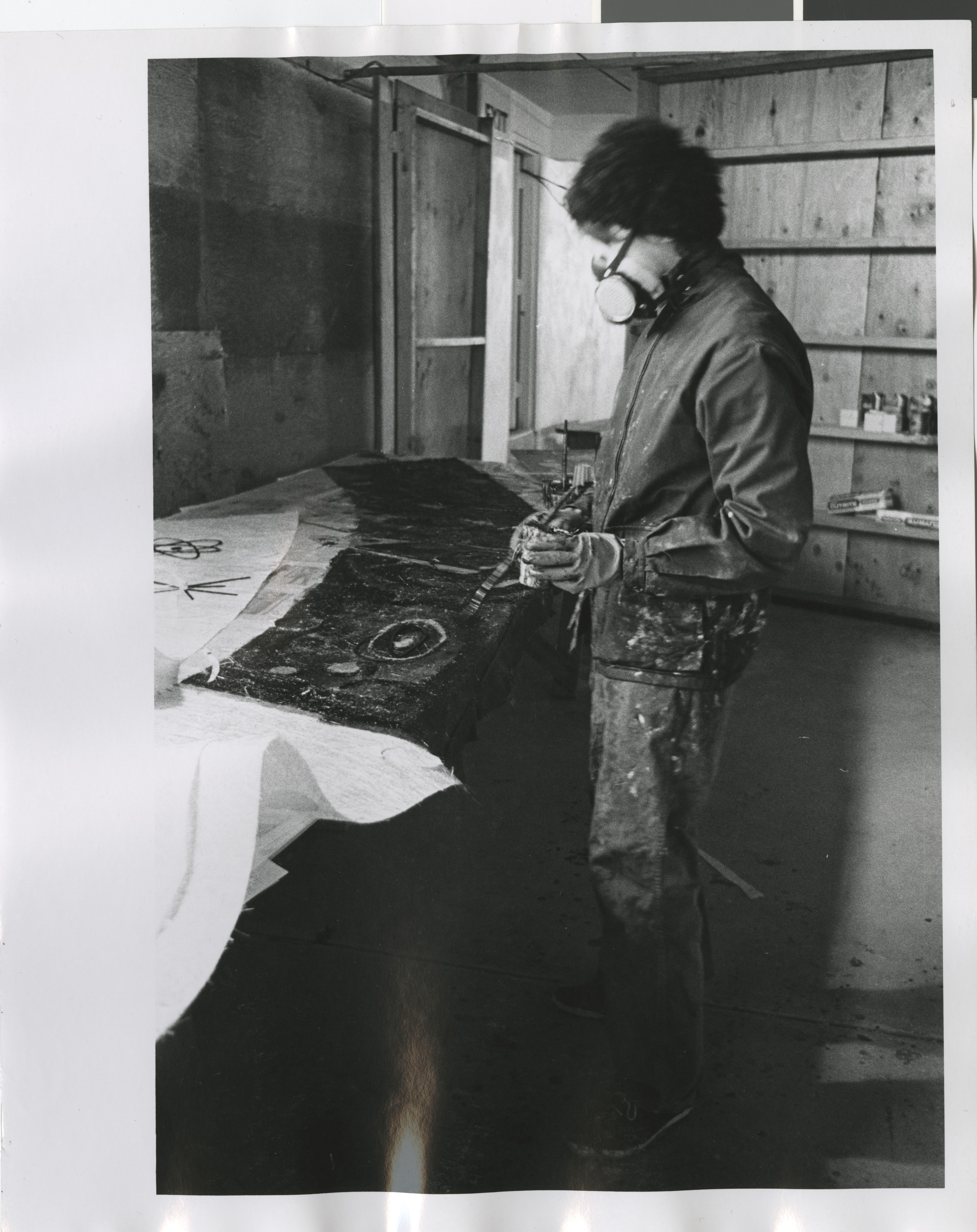 Photograph of Rita Deanin Abbey working on Temple Beth Sholom resin mural, 1970s