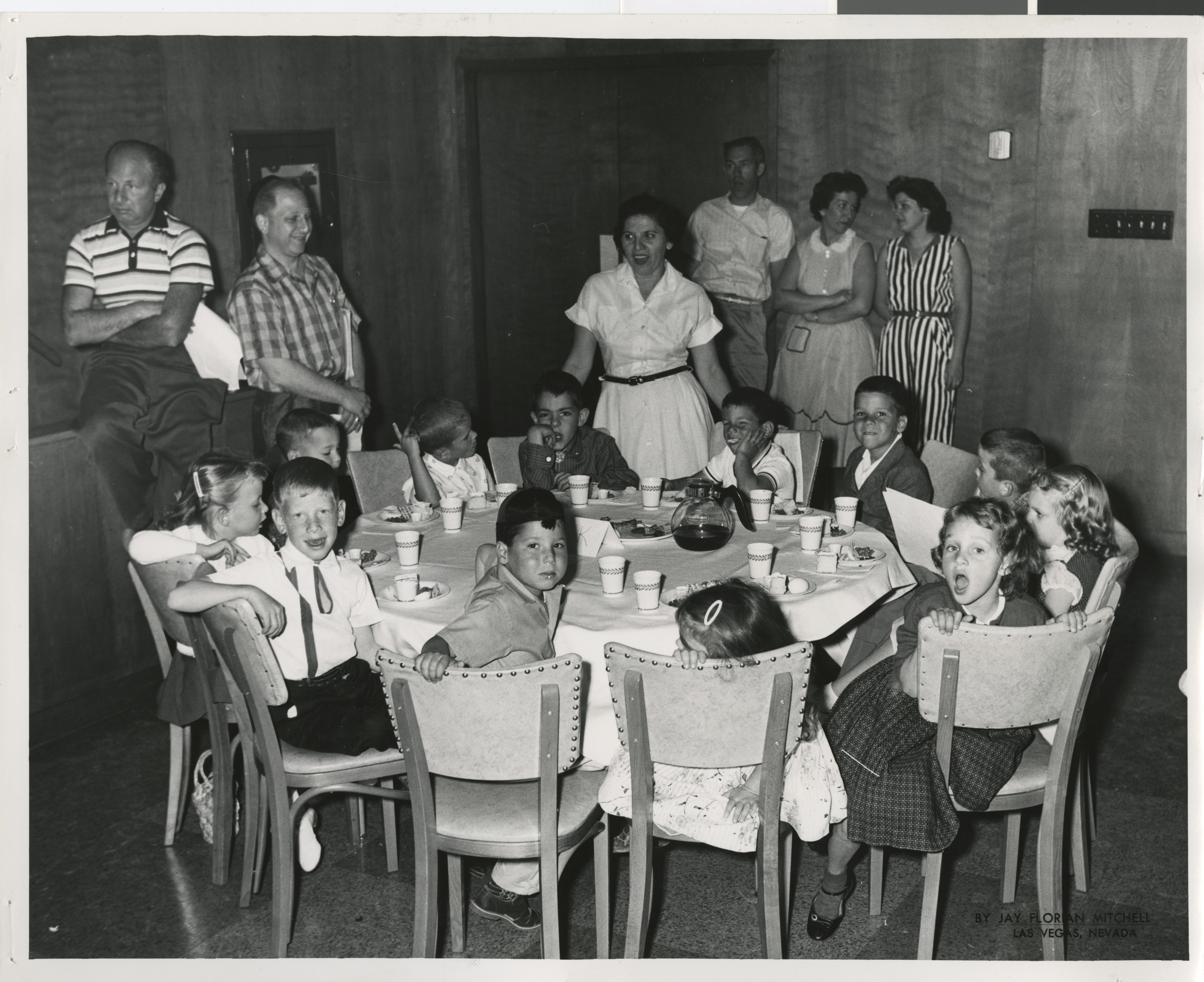 Photograph of a group of children at a round table, 1960s