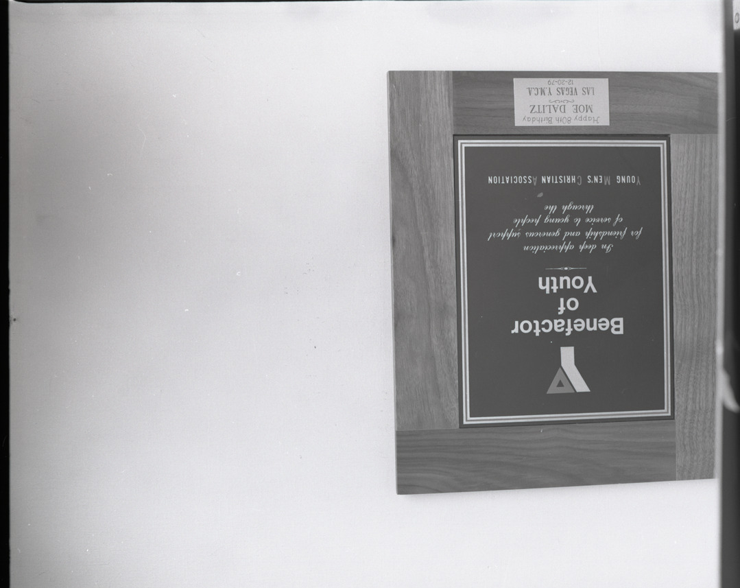 Film negative of plaque for Moe Dalitz from the Young Men's Christian Association on his 80th birthday