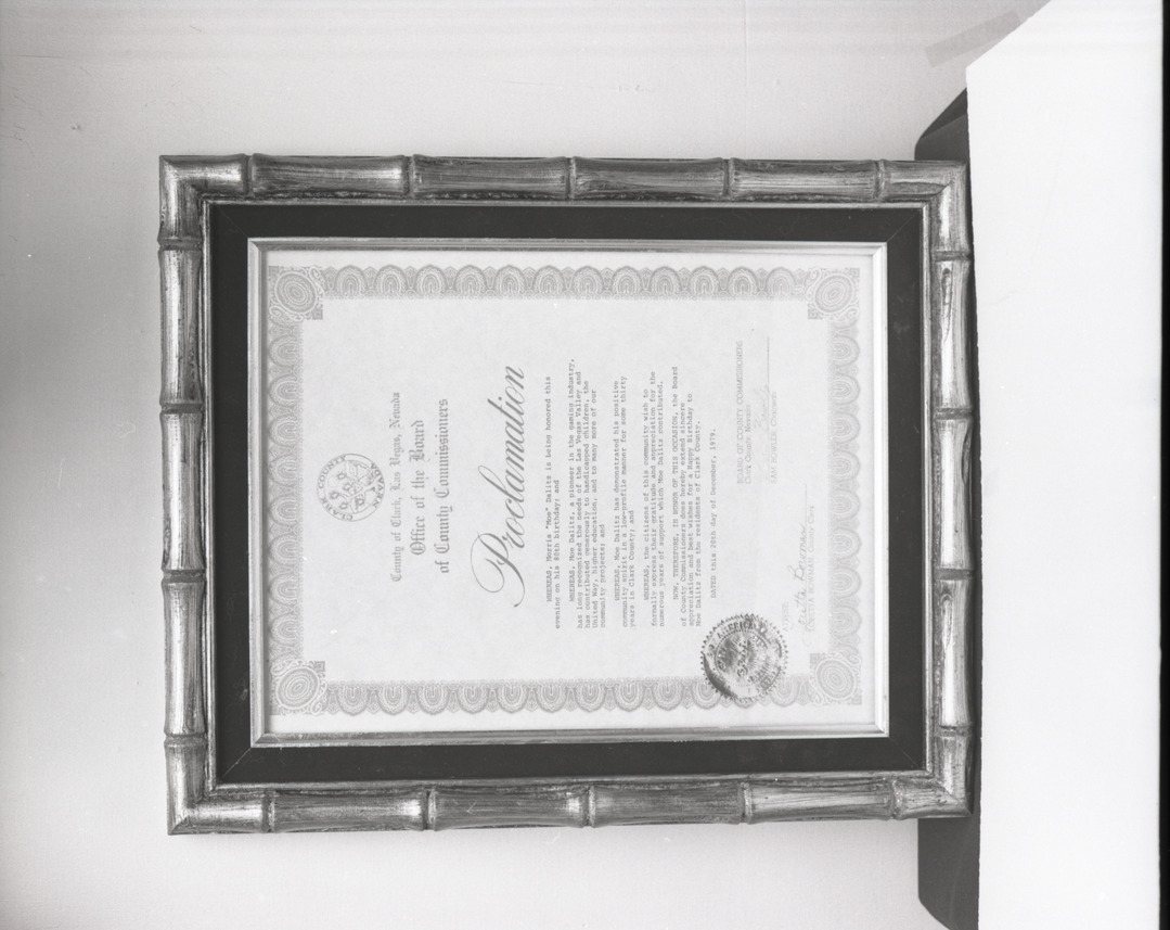 Film negative of plaque, Proclamation from Clark County Board of Commissioners honoring Moe Dalitz on his 80th birthday