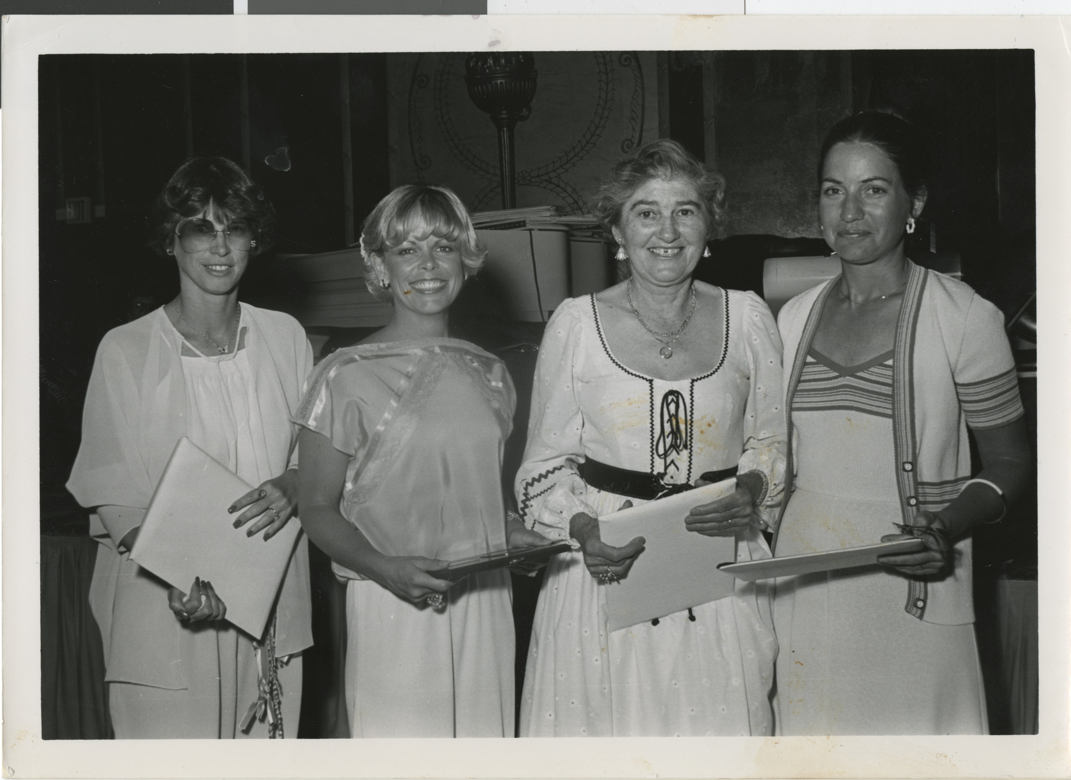 Photograph of group of women including Susan Fine (left), Gertrude Rudiak (second from right) and Roberta Sabbath (far right), holding certificates, date unknown