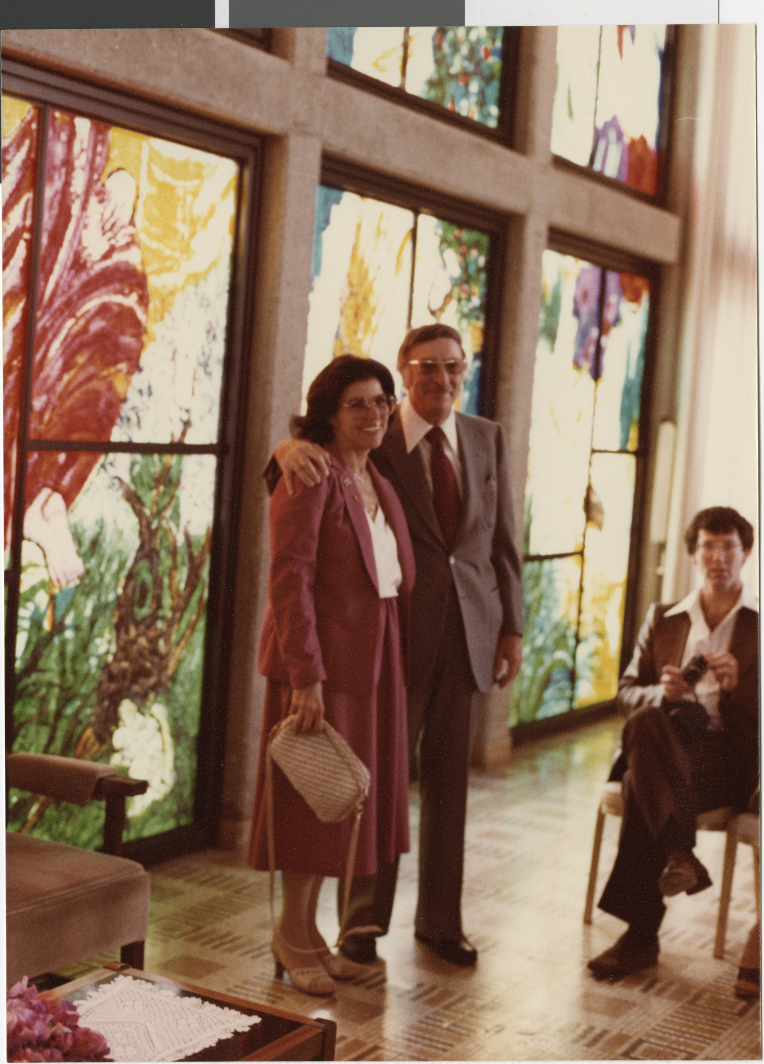 Photograph of Joyce and Jerry Mack at Temple in Jerusalem in front of Chagall windows