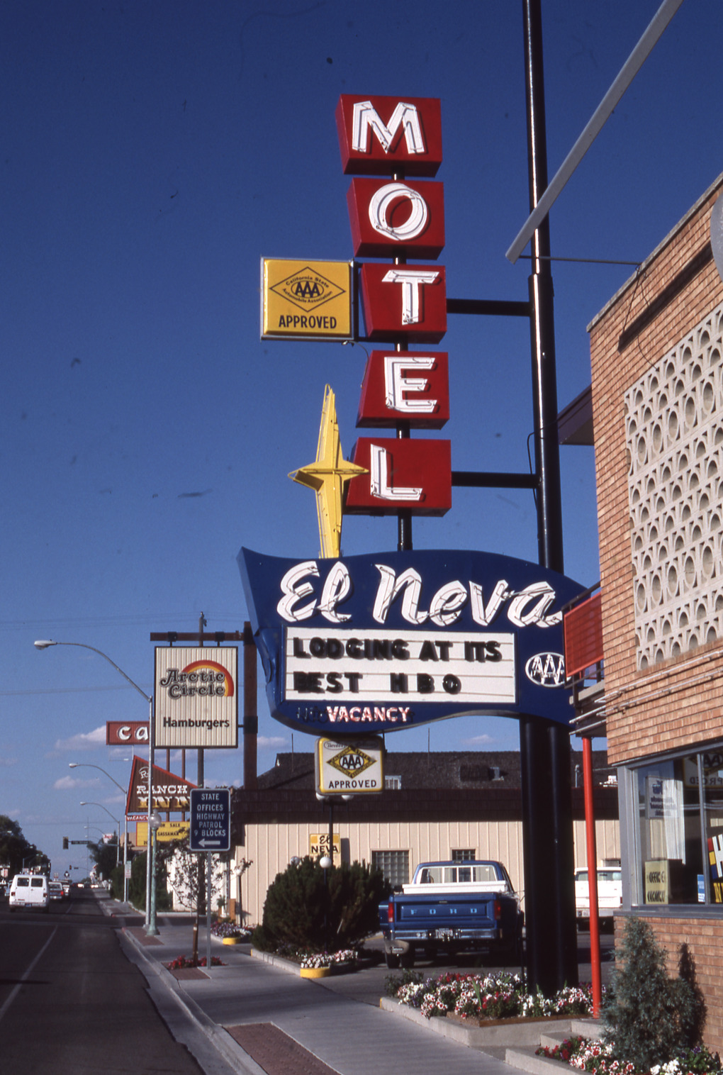 El Neva Motel flag mounted pylon and marquee sign, Elko, Nevada: photographic print