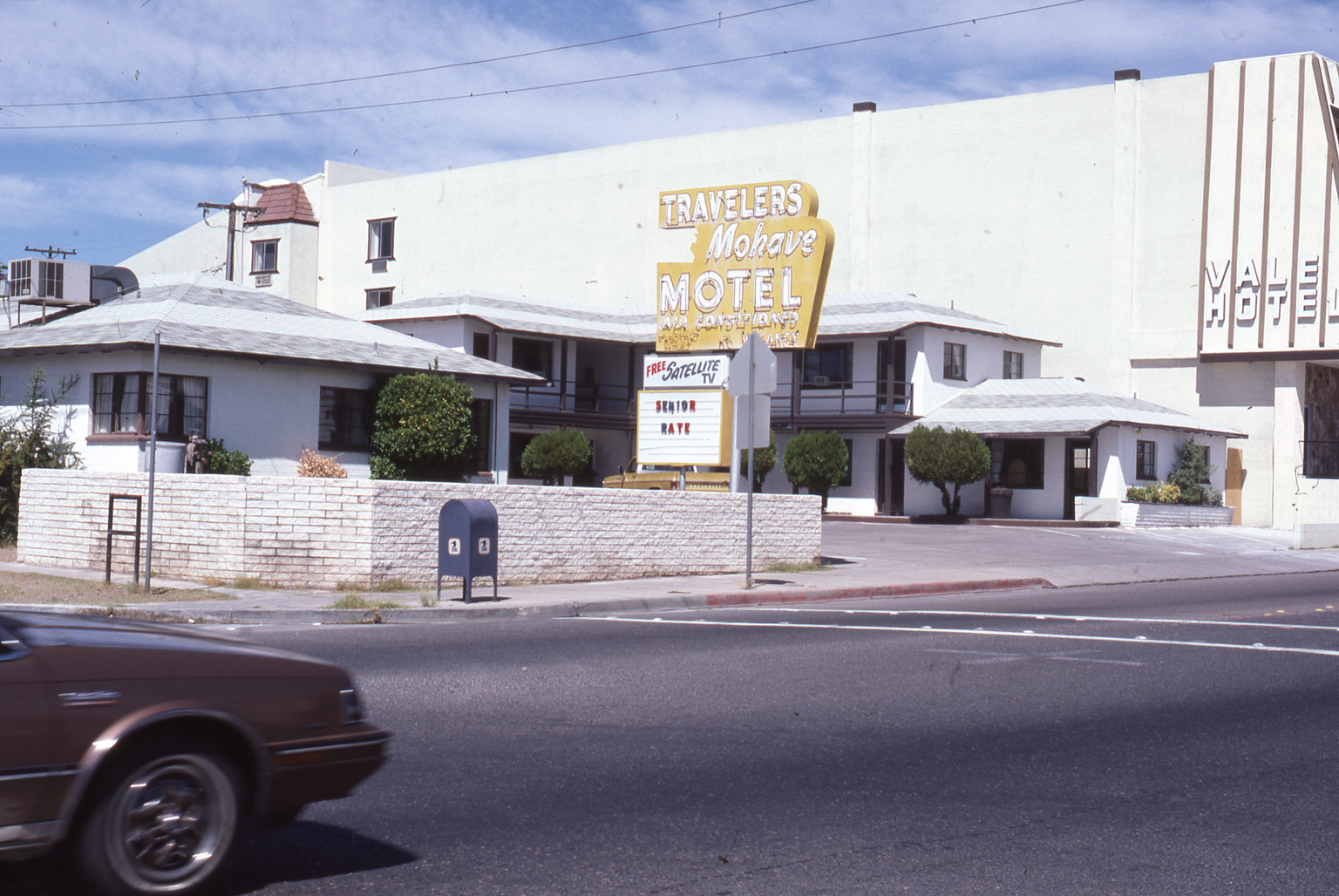 Traveler's Mohave Motel flag mounted pylon and marquee sign, Boulder City, Nevada: photographic print