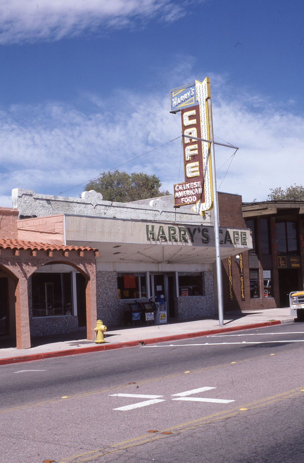 Harry's Cafe flag mounted pylon and wall signs, Boulder City, Nevada: photographic print