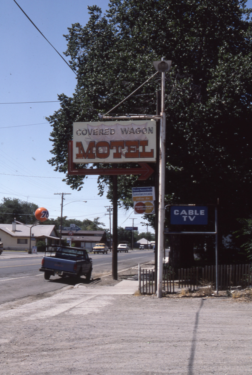 Covered Wagon Motel mounted pylon signs, Lovelock, Nevada: photographic print