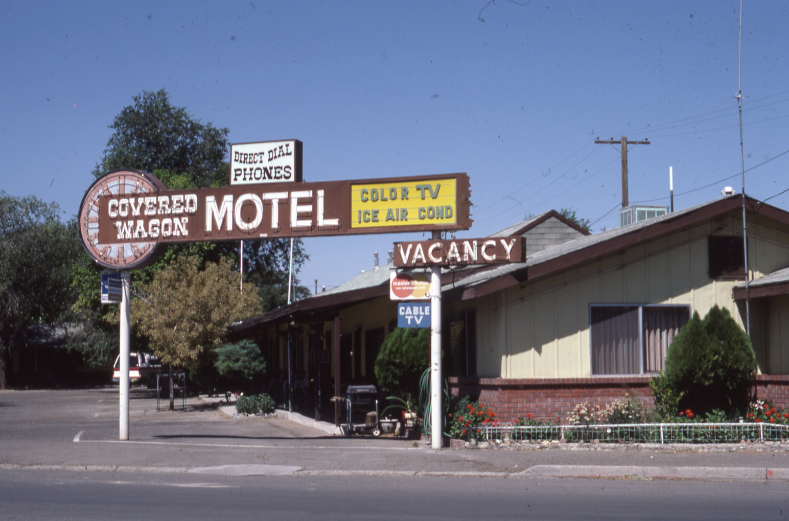 Covered Wagon Motel mounted pylon signs, Lovelock, Nevada: photographic print