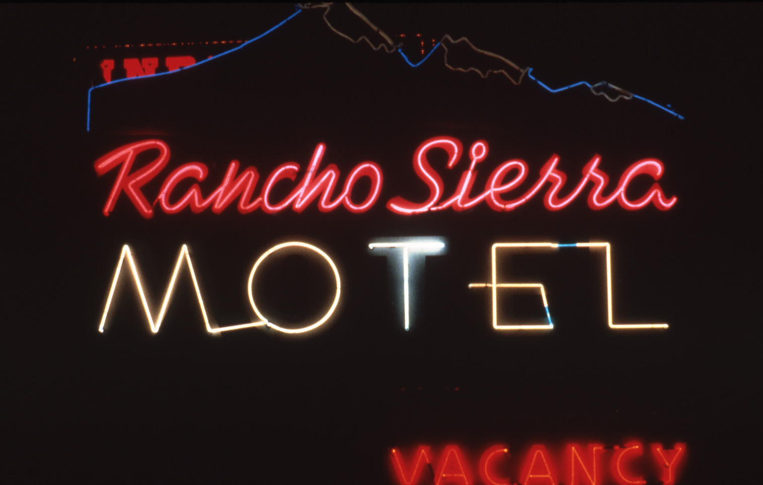 Rancho Sierra Motel flag mounted wall signs, Reno, Nevada: photographic print