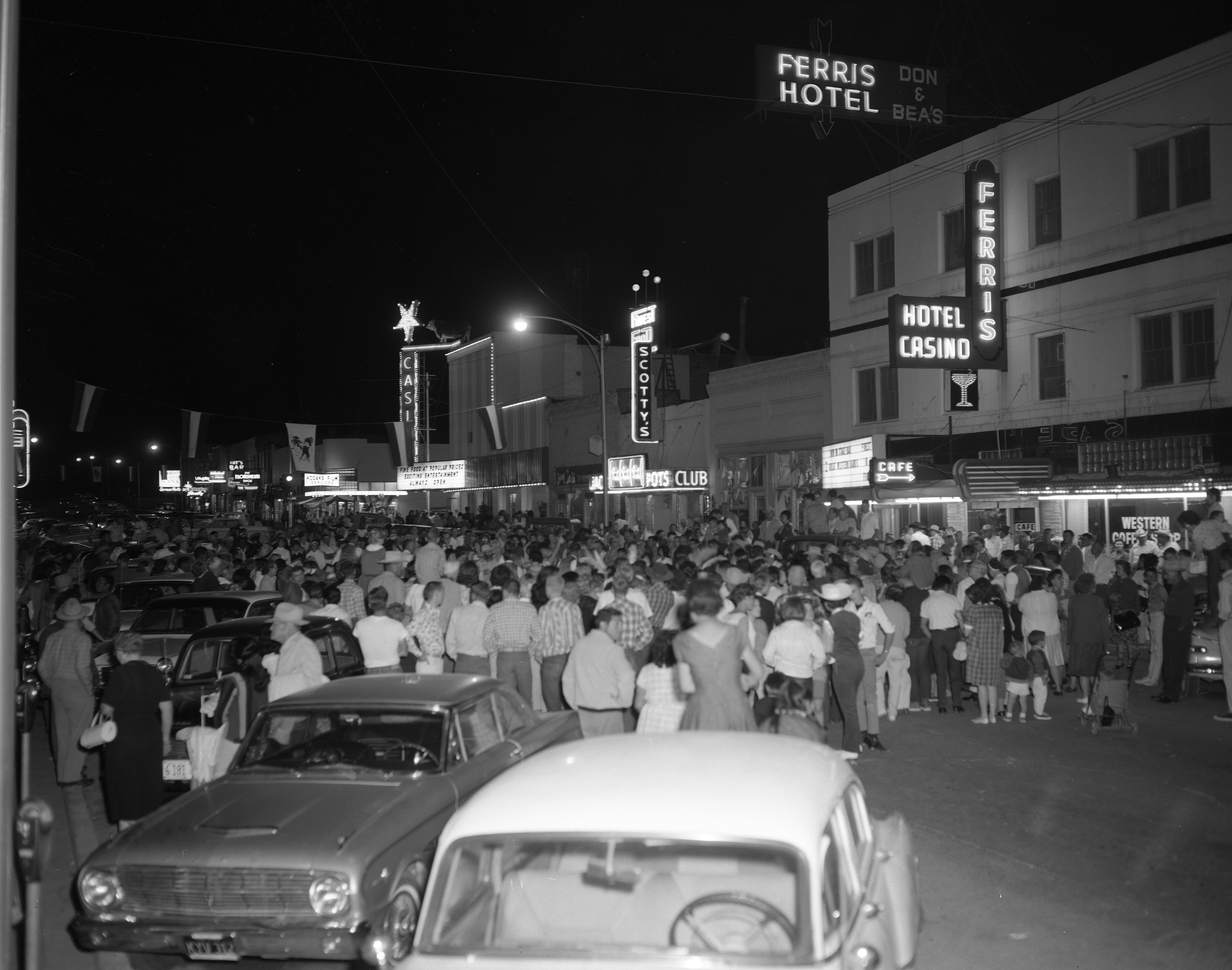 Rodeo Street Dance with Ferris Hotel wall signs and other buildings with neon in the background, Winnemucca, Nevada: photographic print
