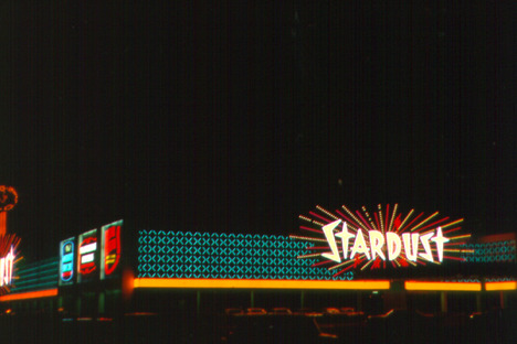 Photograph of neon signs on the front and side exteriors of the Stardust Hotel and Casino (Las Vegas), 1969