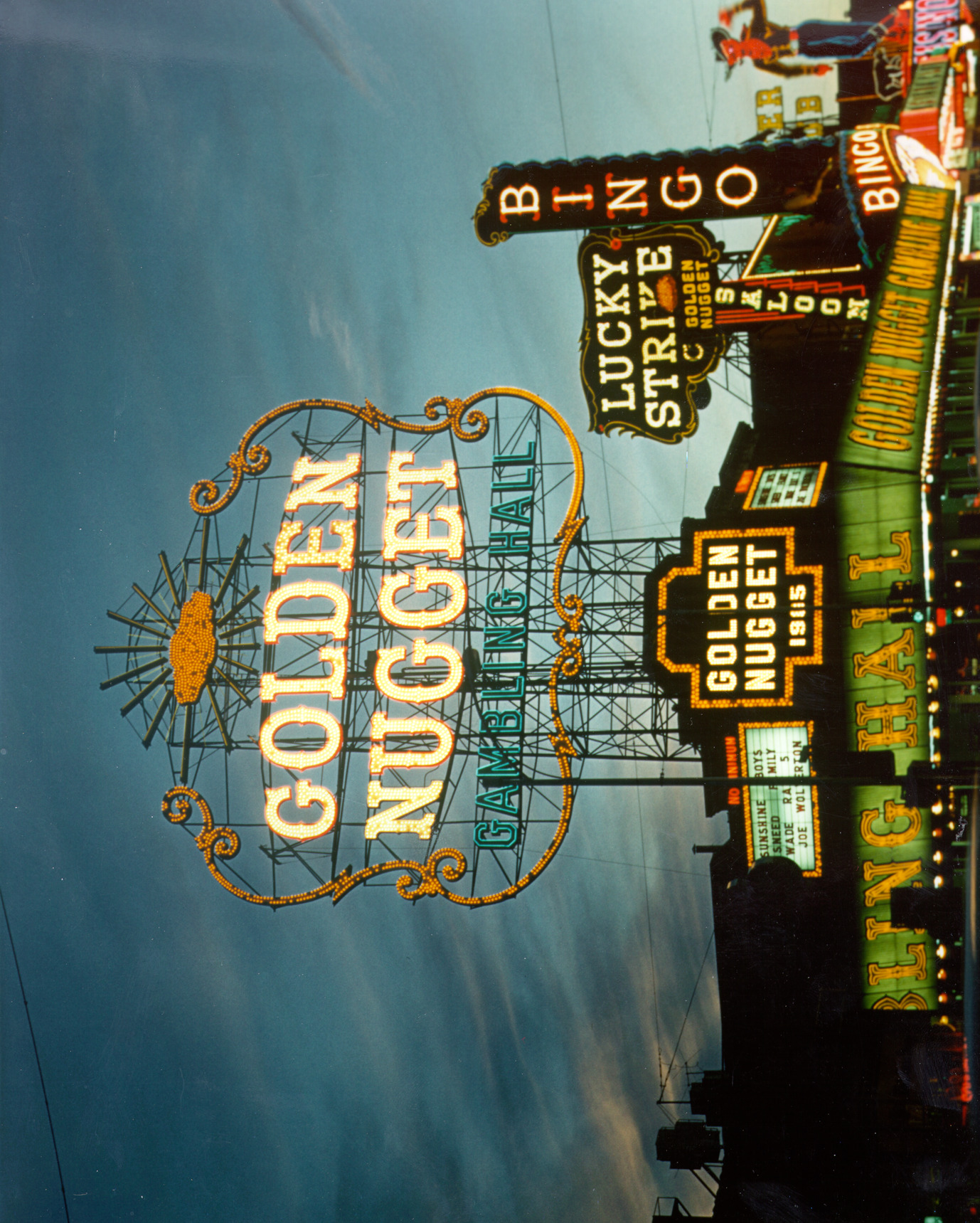 Photograph of exterior corner of the Golden Nugget Gambling Hall at dusk (Las Vegas), circa 1951