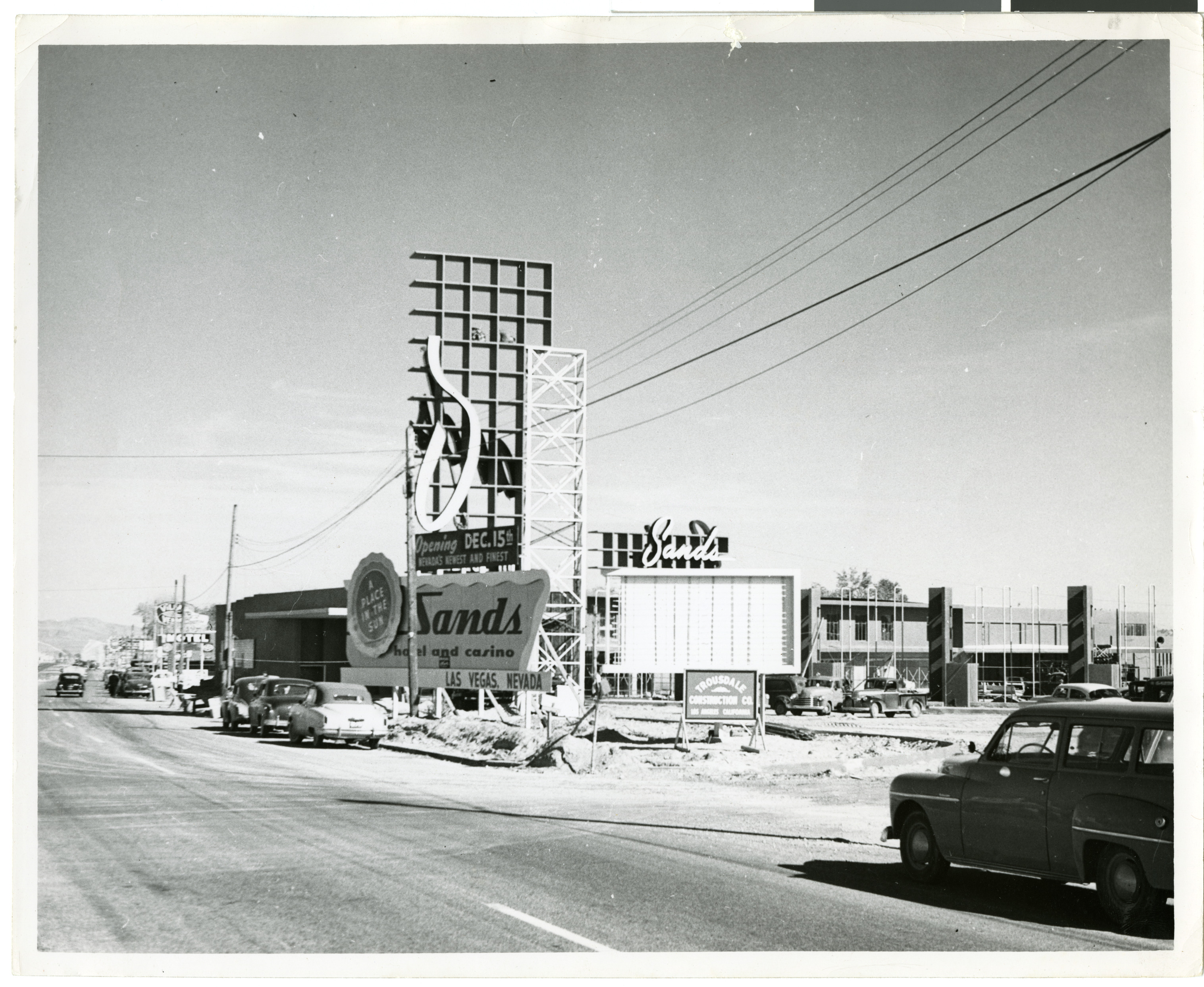 Photograph of the assembly of the sign in front of the Sands (Las Vegas), circa 1953